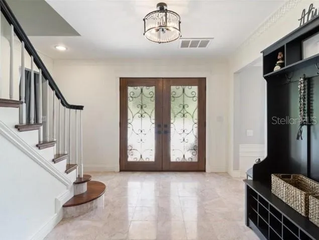a view of an entryway with wooden floor