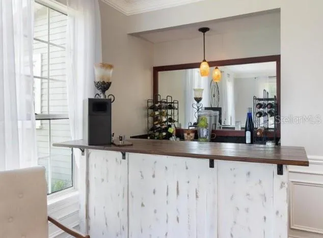 a kitchen view living space with furniture and a window