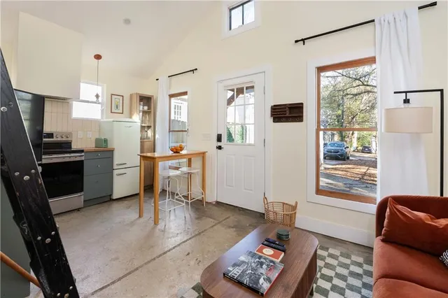a kitchen with stainless steel appliances kitchen island granite countertop a sink and cabinets