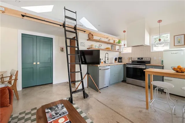 a bedroom with a bed and cabinets