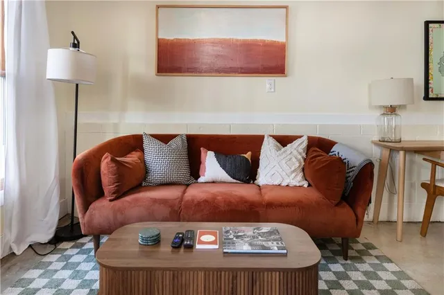 a kitchen with stainless steel appliances granite countertop a sink a stove and refrigerator