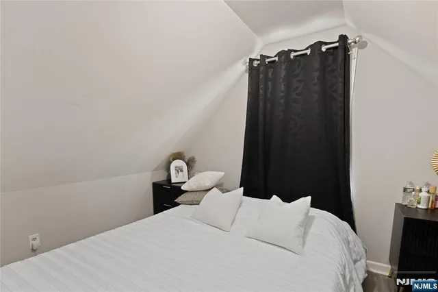 a bedroom with a bed and a closet