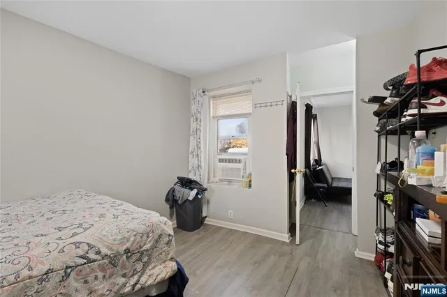 a bedroom with a bed and a walk in closet