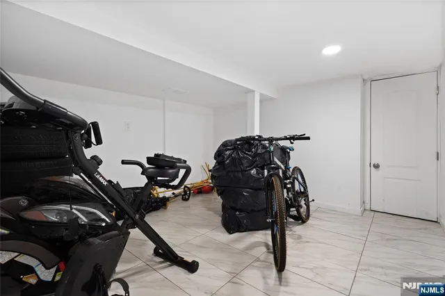 a living room with furniture and a air conditioner vent