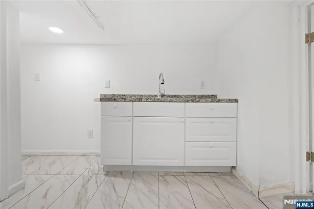 a view of storage and utility room with empty racks