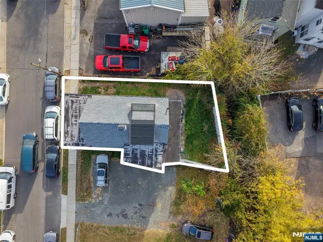 an outdoor space view with two chairs and potted plants
