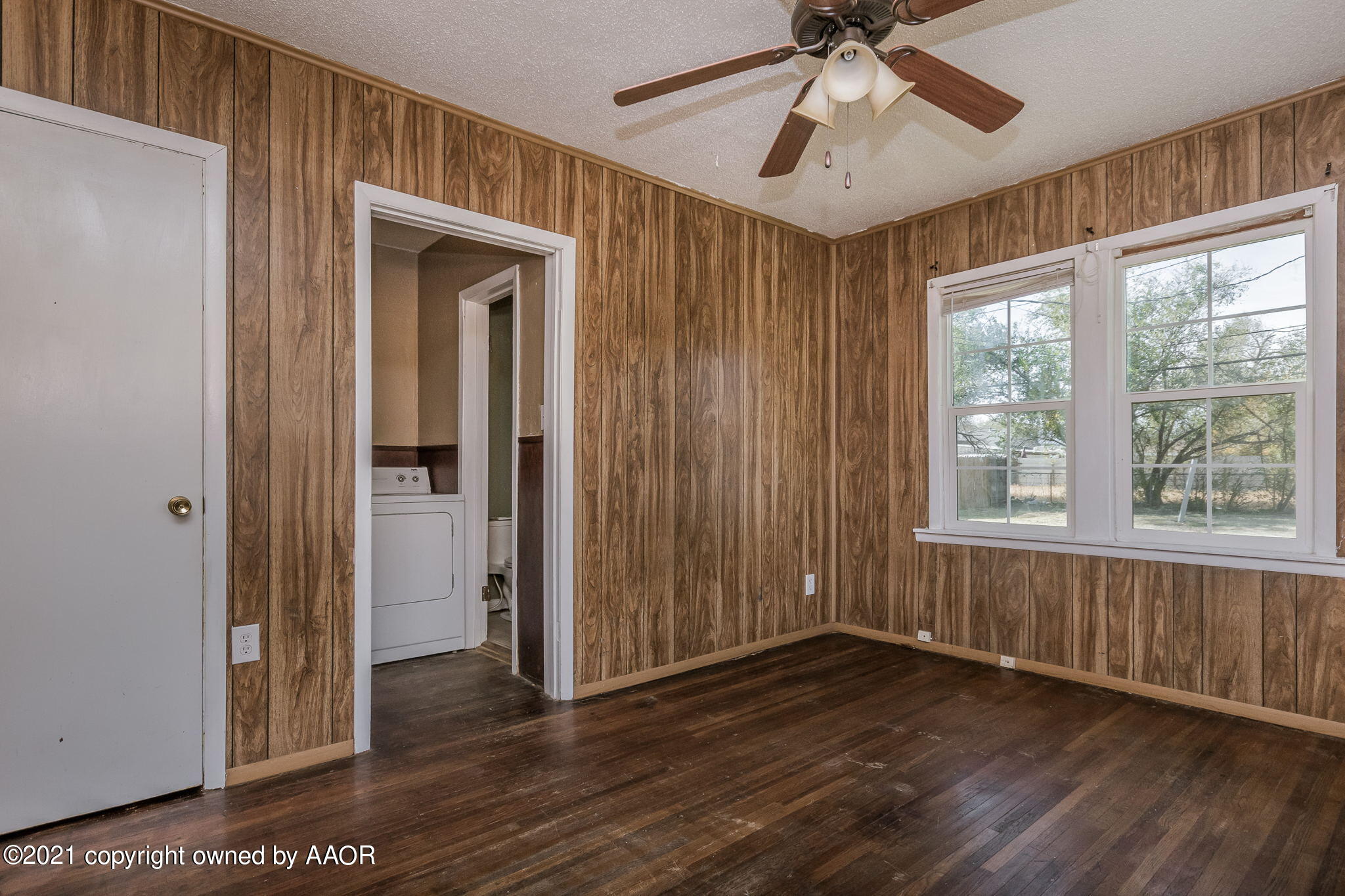 1104 South Western Street Amarillo, TX 79106 - Photo 10 of 29 a view of empty room with wooden floor and fan