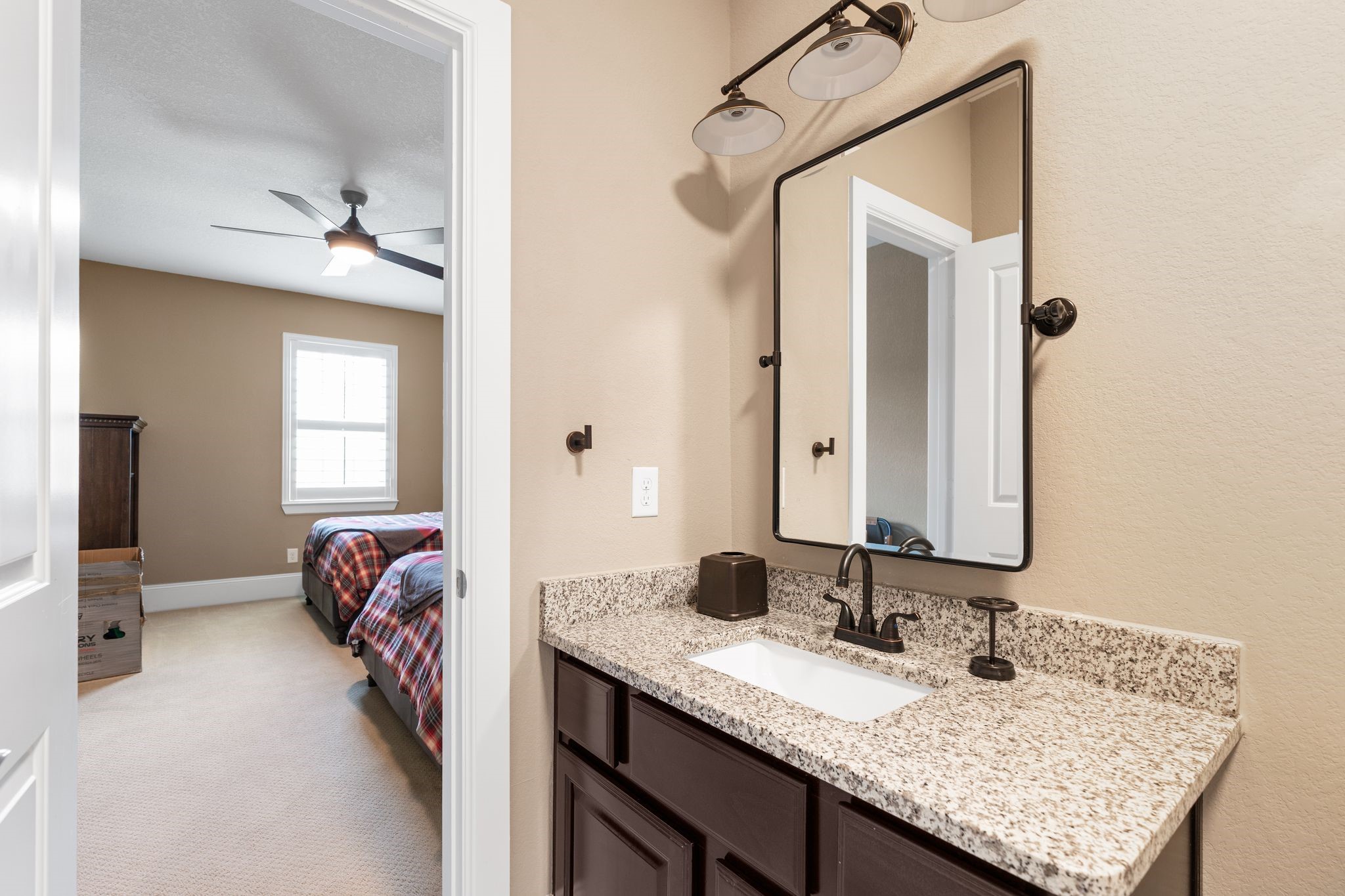2914 Rutherford Pl Court Katy, TX 77494 - Photo 43 of 50 a en suite bathroom with a granite countertop sink and a mirror