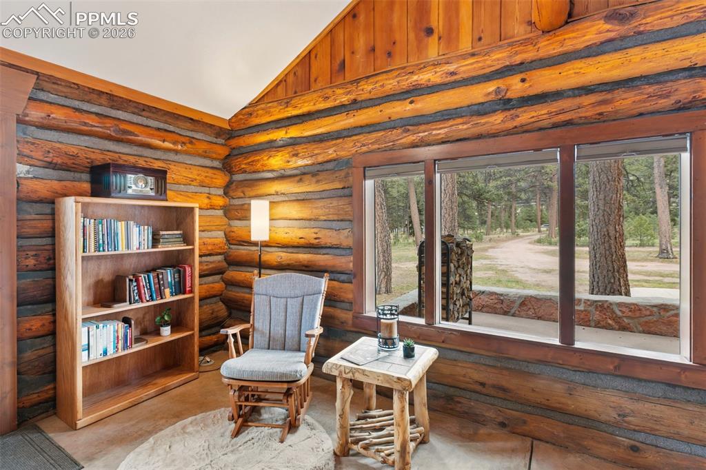 1100 Rampart Range Road Woodland Park, CO 80863 - Photo 7 of 50 Enjoy your morning coffee with your favorite book in the reading nook overlooking the porch