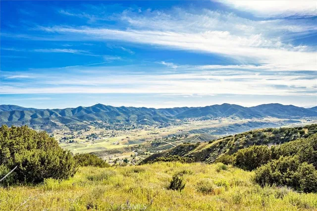 a view of a city with mountains in the background