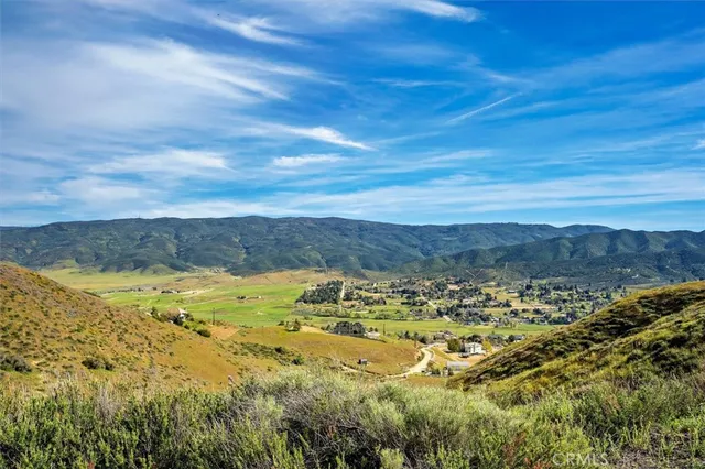 a view of mountain and an ocean
