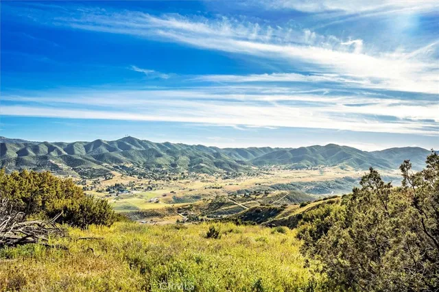 a view of mountain with lake view
