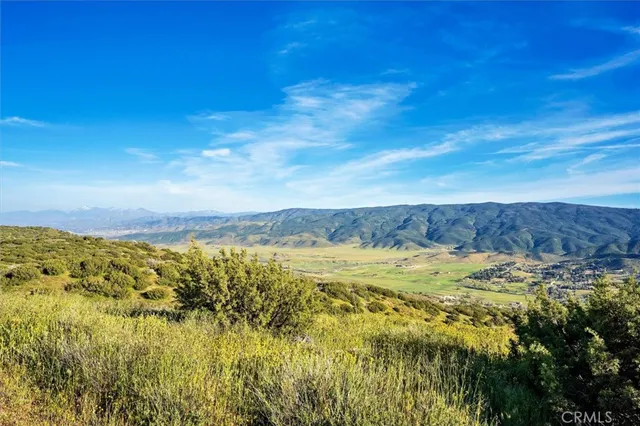 a view of a city with mountains in the background
