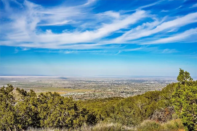 a view of mountain with an ocean