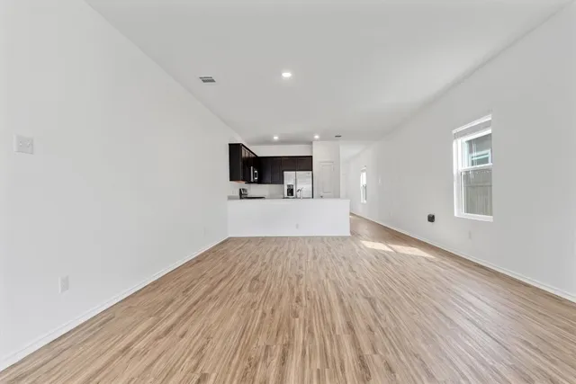 a view of a kitchen with a sink and a microwave