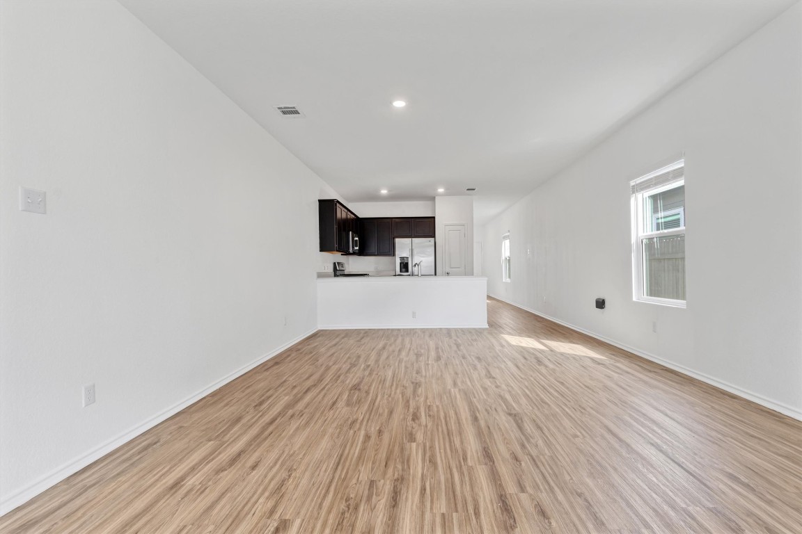 348 Soapstone Pass Maxwell, TX 78656 - Photo 12 of 18 a view of a kitchen with a sink and a microwave