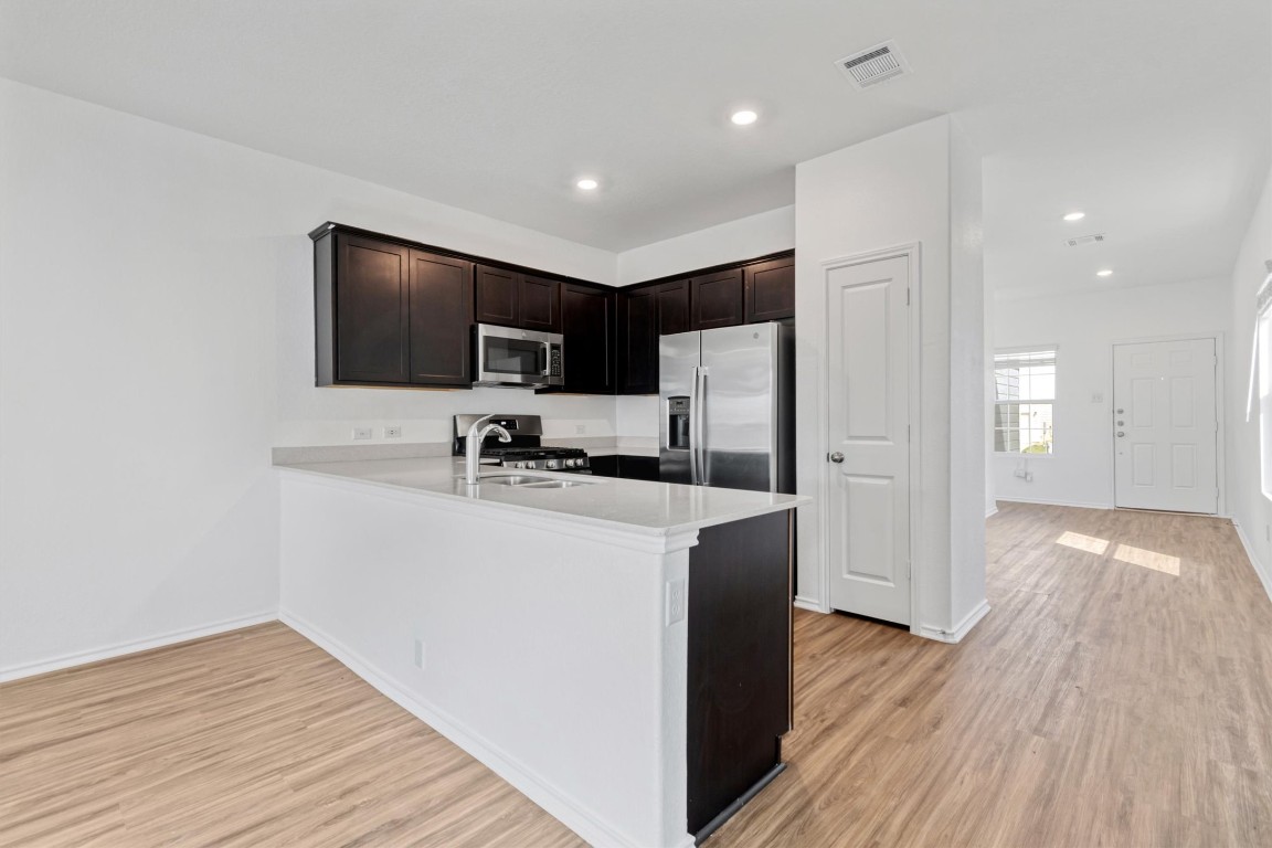 348 Soapstone Pass Maxwell, TX 78656 - Photo 3 of 18 a view of kitchen with cabinets and stainless steel appliances