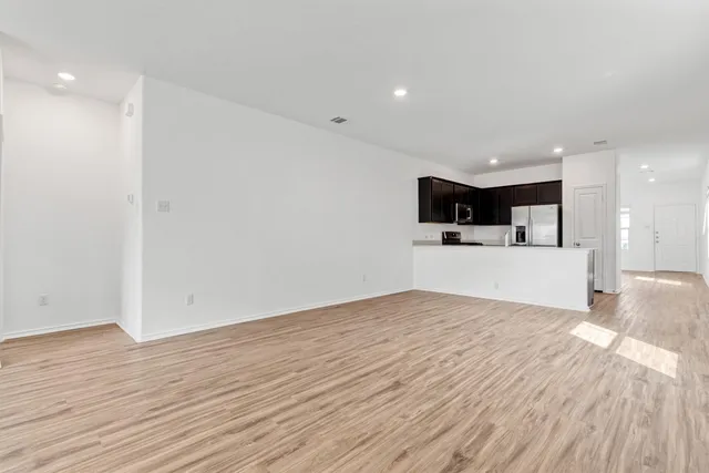 a view of a kitchen with a sink and a microwave