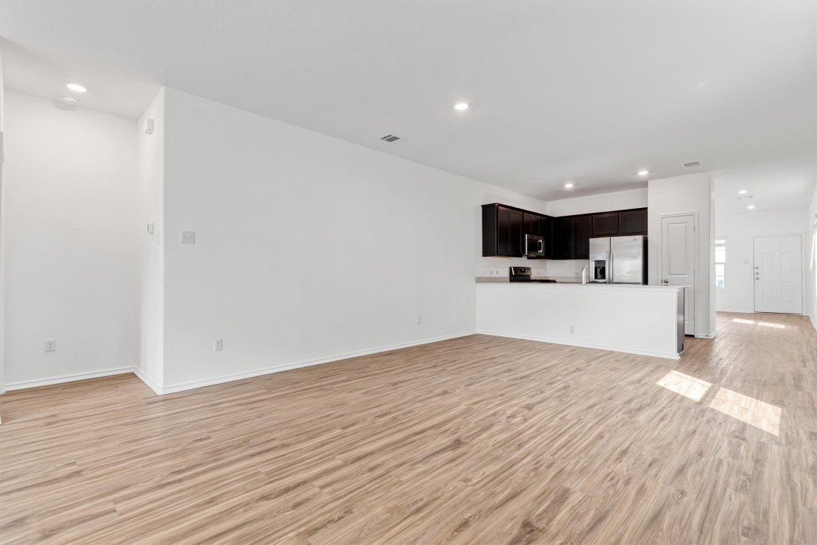 348 Soapstone Pass Maxwell, TX 78656 - Photo 6 of 18 a view of a kitchen with a sink and a microwave
