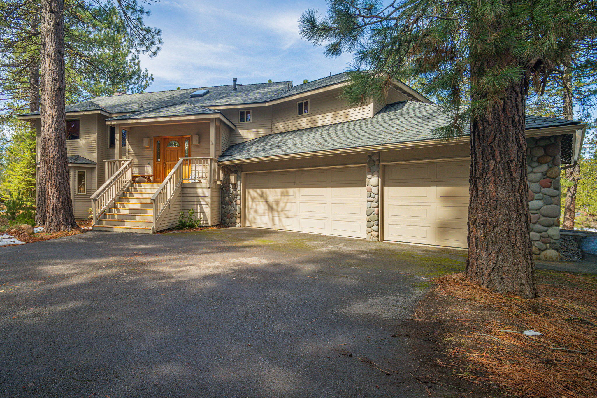 17948 Shadow Lane, Unit 7 Sunriver, OR 97707 - Photo 82 of 92 a view of a house with a yard and garage