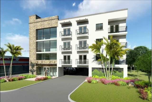 a front view of building with yard