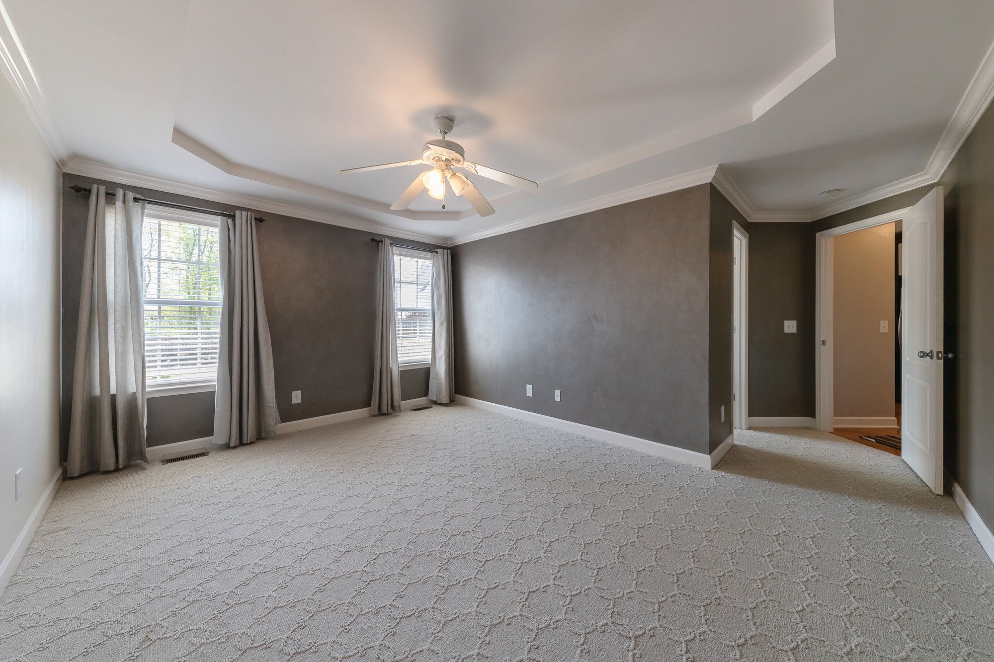 631 Harkreader Road Mount Juliet, TN 37122 - Photo 13 of 30 an empty room with windows and chandelier fan