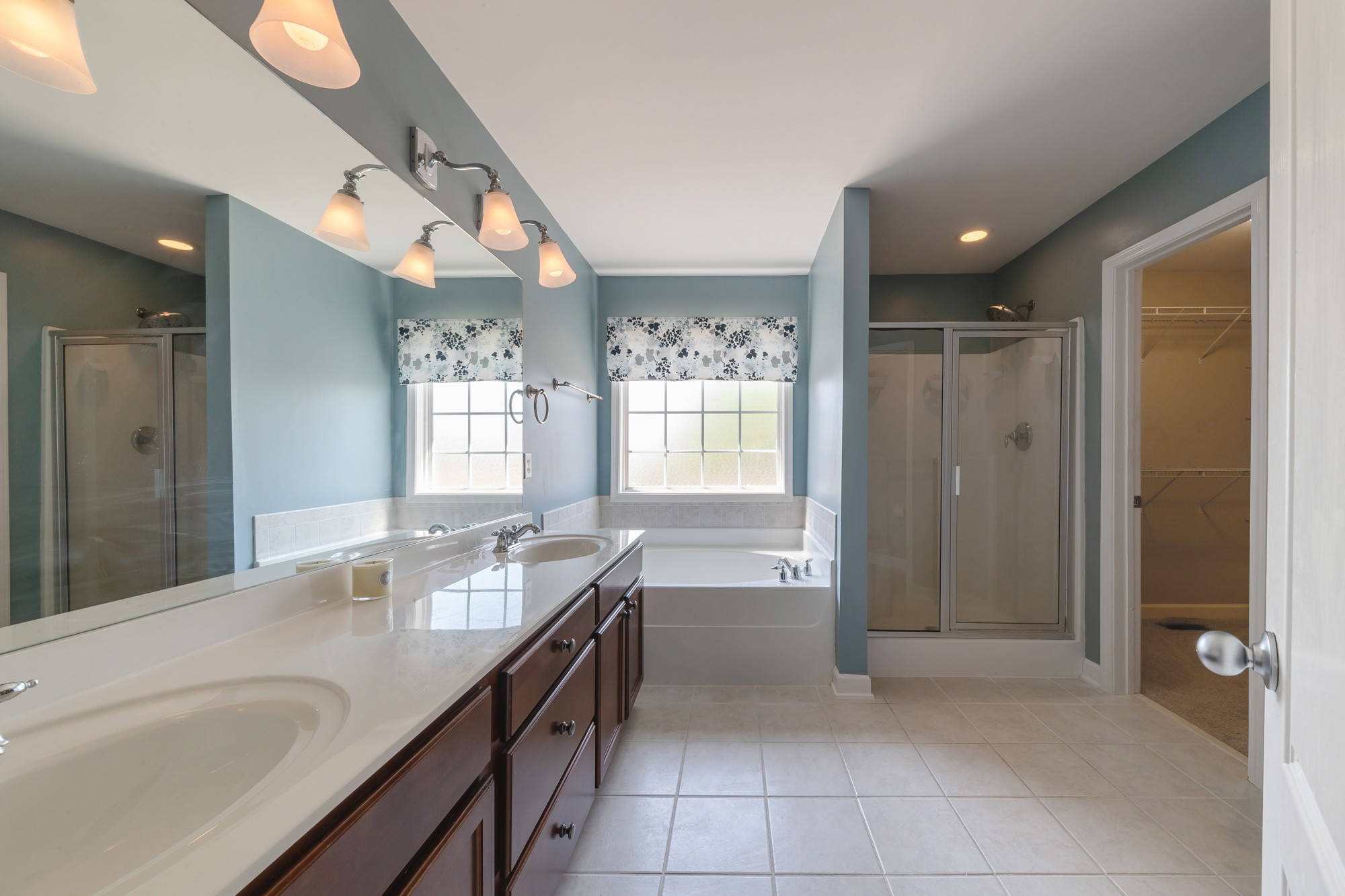 631 Harkreader Road Mount Juliet, TN 37122 - Photo 15 of 30 a spacious bathroom with a granite countertop sink a toilet a mirror and shower