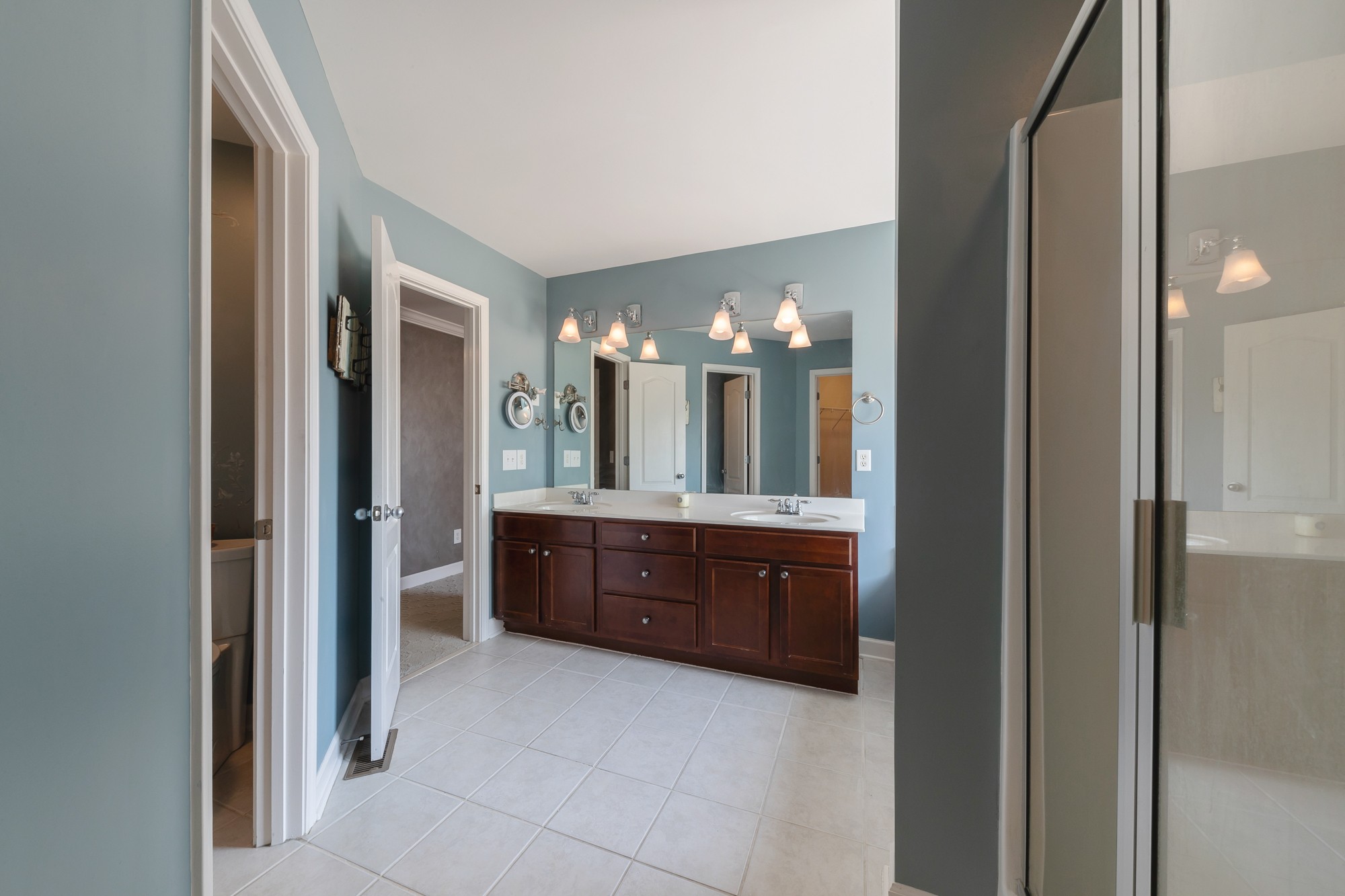 631 Harkreader Road Mount Juliet, TN 37122 - Photo 16 of 30 a large bathroom with a double vanity sink and a mirror