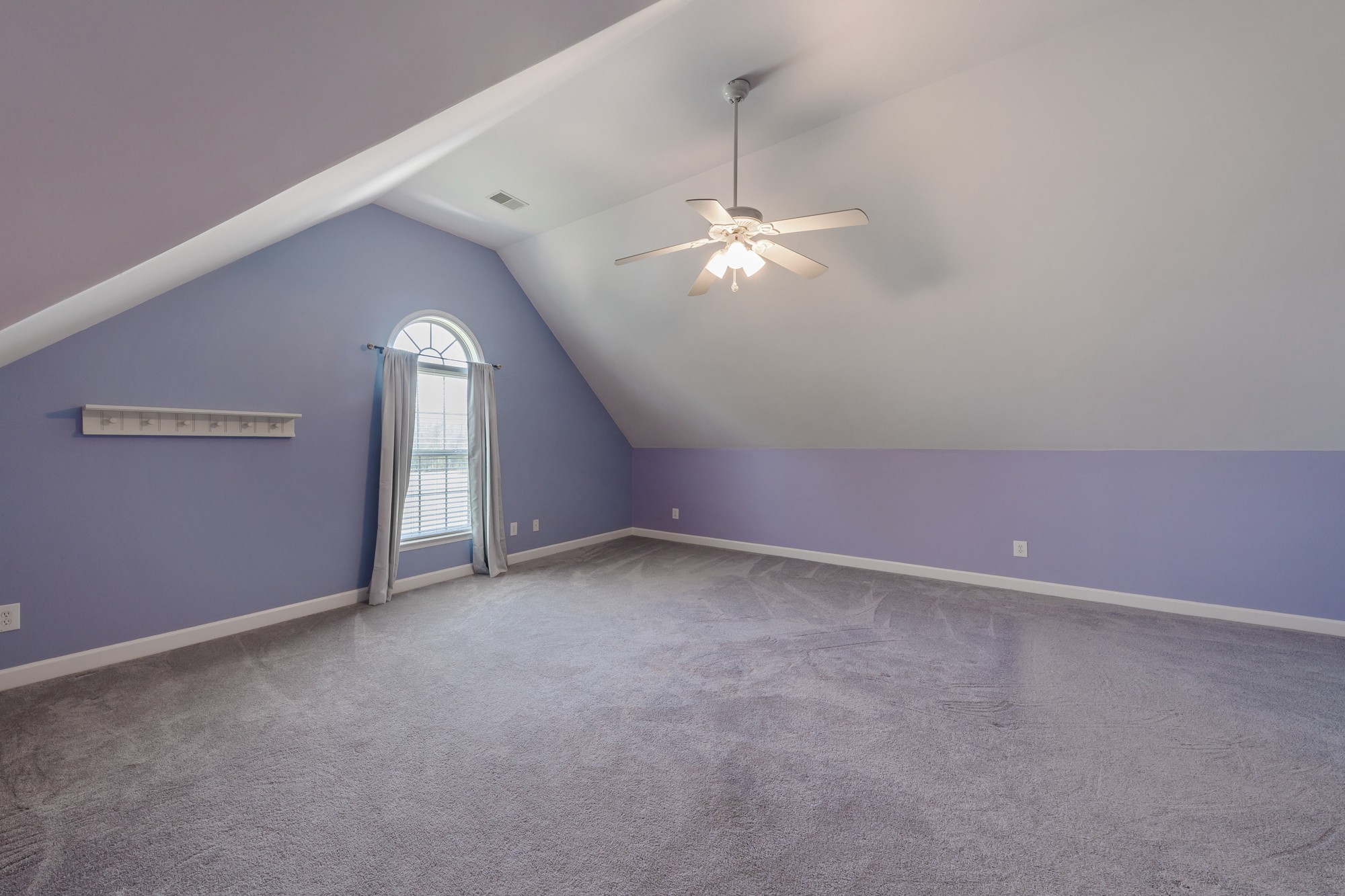 631 Harkreader Road Mount Juliet, TN 37122 - Photo 20 of 30 an empty room with a chandelier fan and windows