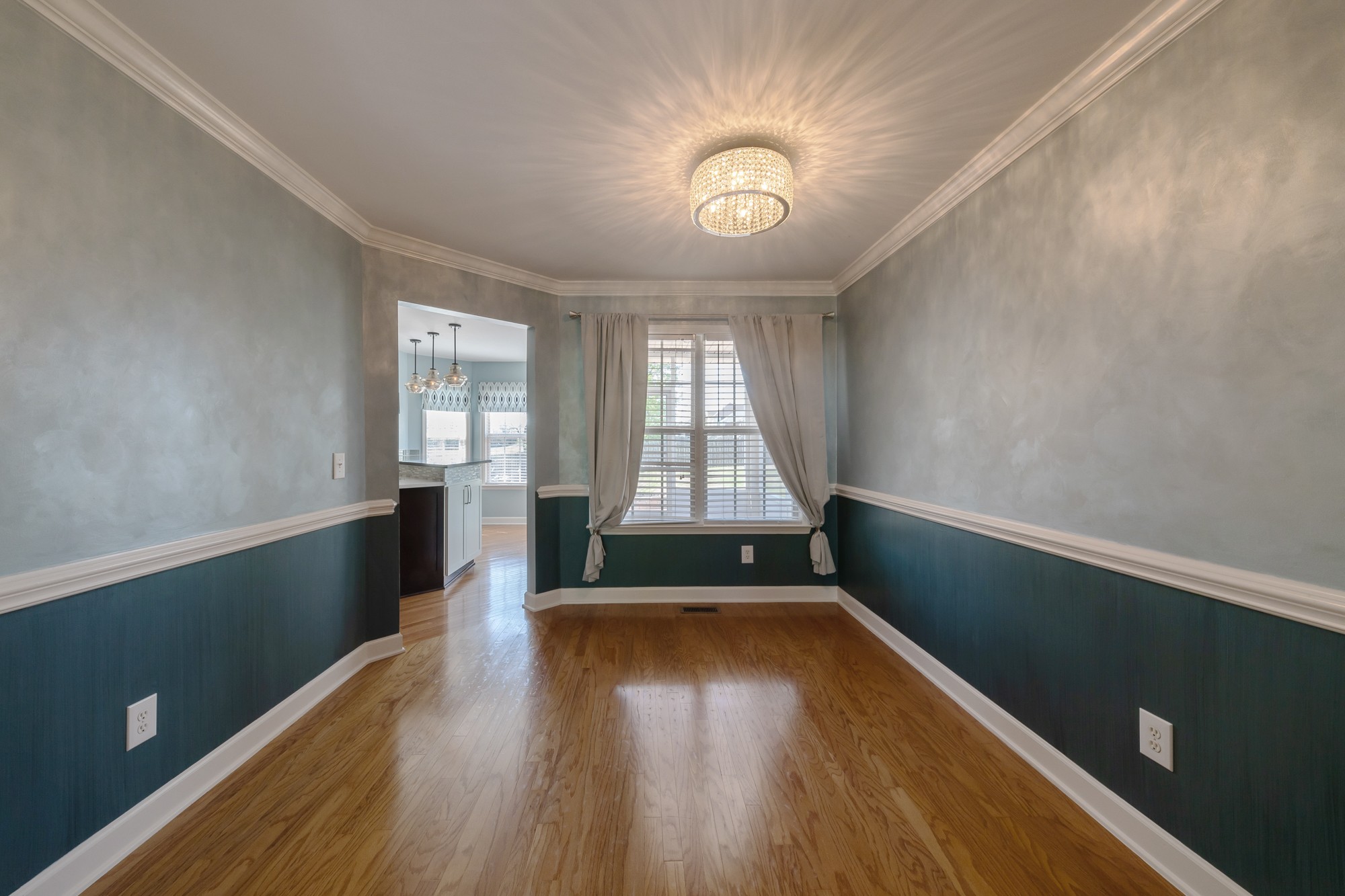 631 Harkreader Road Mount Juliet, TN 37122 - Photo 7 of 30 an empty room with wooden floor and windows