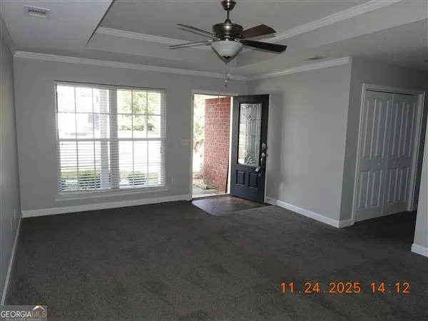 a view of an empty room with a window