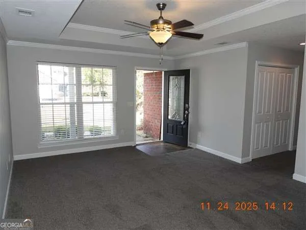 a view of an empty room with a window