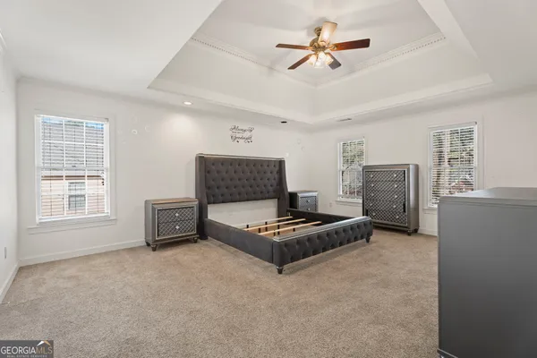 a living room with furniture a fireplace and a window