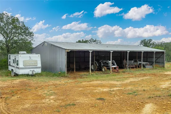 a view of a lake in between the two of trees