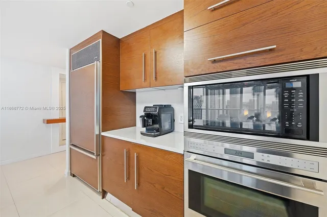 a kitchen with a stove and a microwave