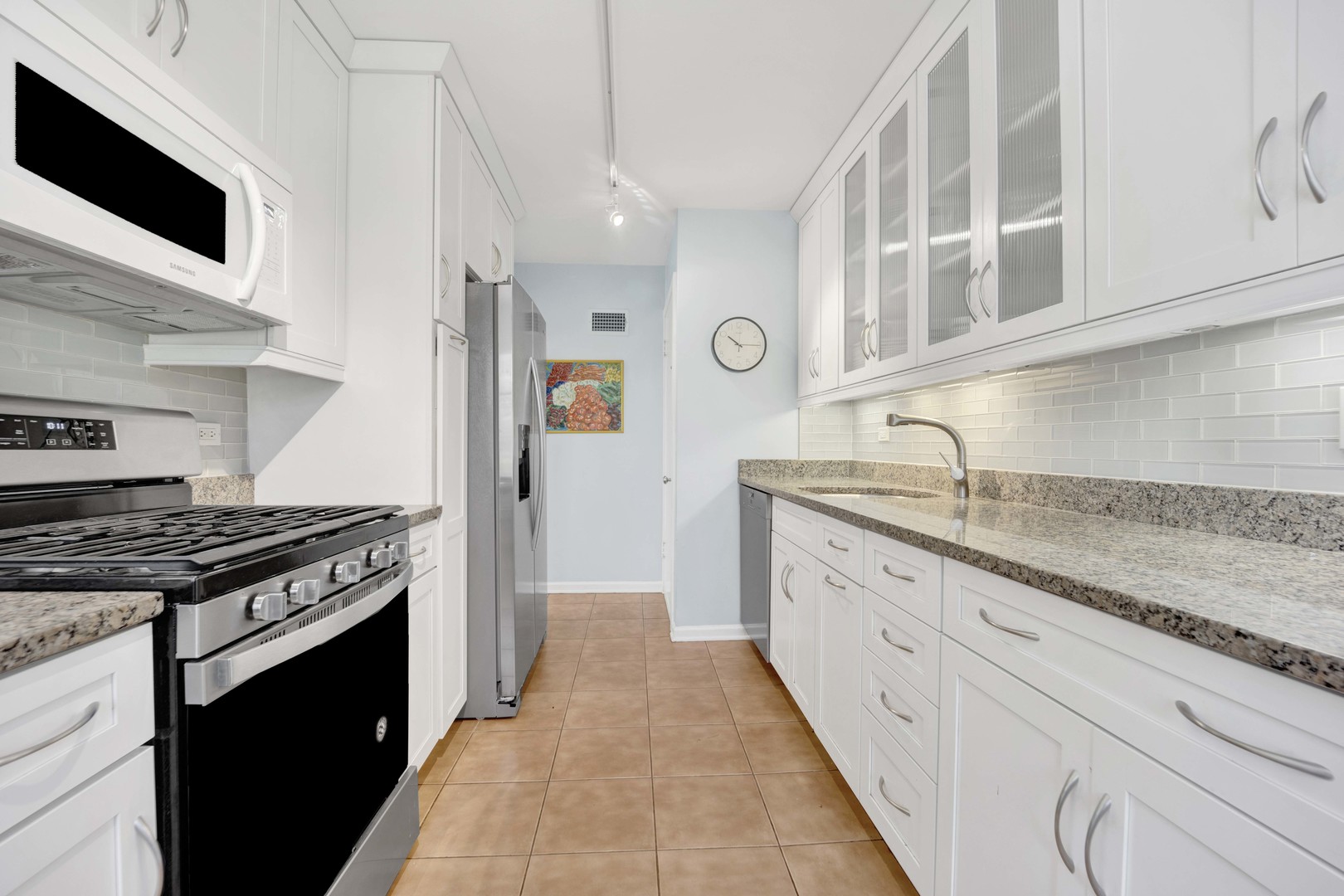 80 Williamsburg Road Evanston, IL 60203 - Photo 13 of 28 a kitchen with granite countertop cabinets stainless steel appliances and a sink