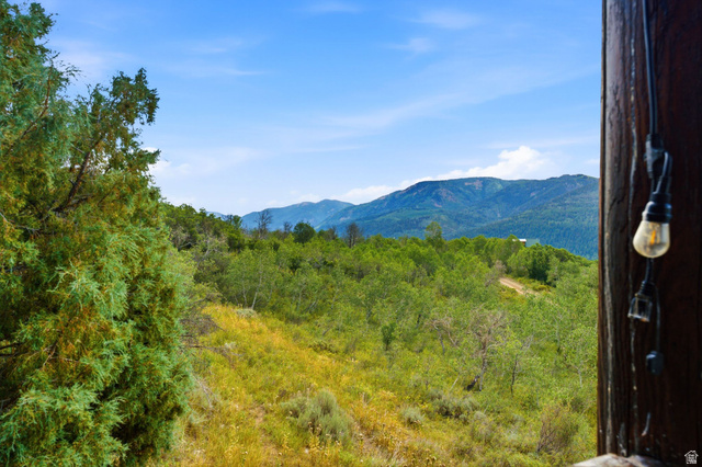 5404 Mountain View Road Coalville, UT 84017 - Photo 5 of 50 Expansive natural landscape with varied foliage, distant mountains, and a clear blue sky