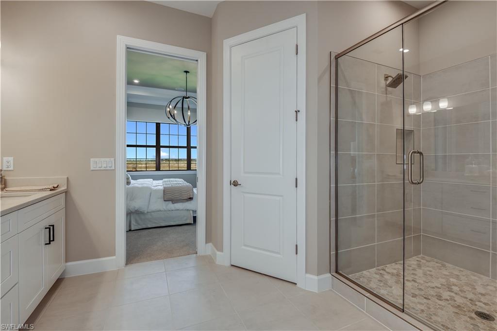15336 Lucerna Street, Unit 203 Naples, FL 34114 - Photo 10 of 15 a en suite bathroom with a shower
