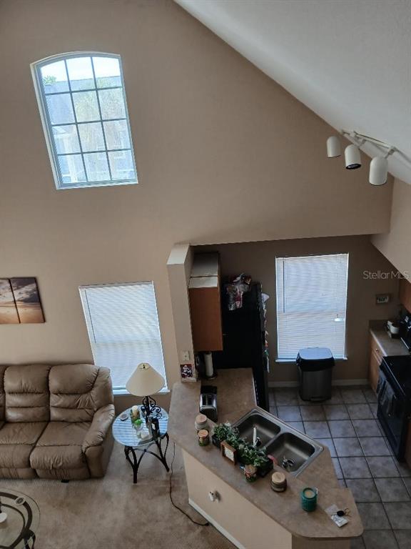 5581 Rosehill Road, Unit 203 Sarasota, FL 34233 - Photo 15 of 17 a living room with furniture and a window