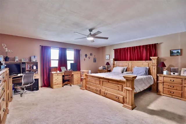 a bed room with a bed and furniture