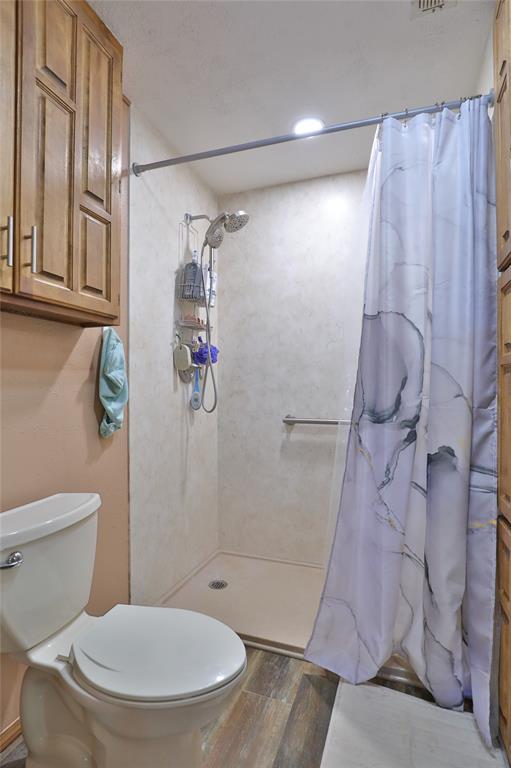 448 Elmdale Road South Abilene, TX 79602 - Photo 17 of 39 a bathroom with a toilet and shower
