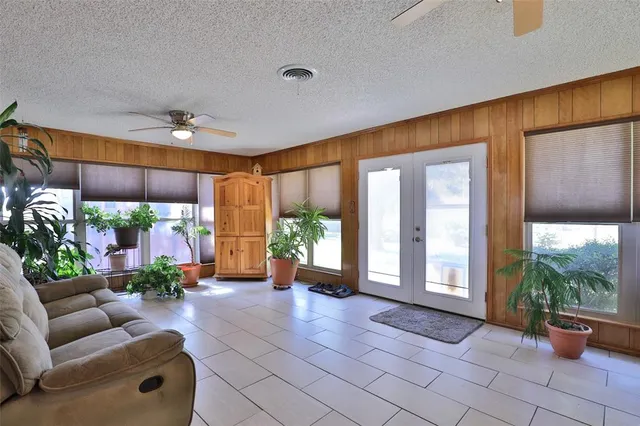 a lobby with furniture and a floor to ceiling window