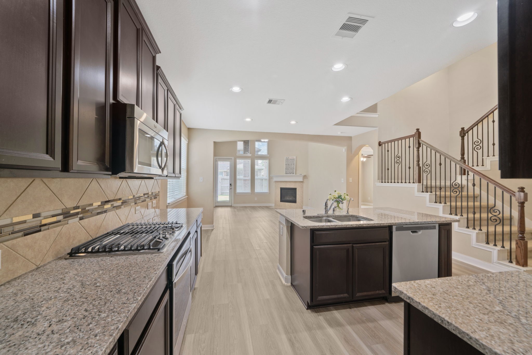 22523 Birch Ridge Meadow Drive Spring, TX 77389 - Photo 16 of 39 a kitchen with a stove and a sink