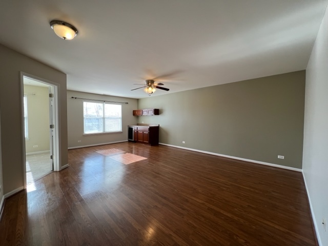 Undisclosed Address Naperville, IL 60564 - Photo 14 of 26 an empty room with wooden floor and windows