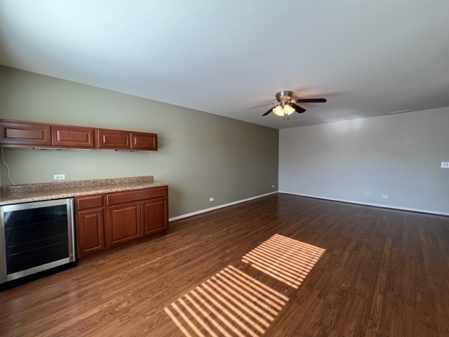Undisclosed Address Naperville, IL 60564 - Photo 16 of 26 a view of an empty room with wooden floor