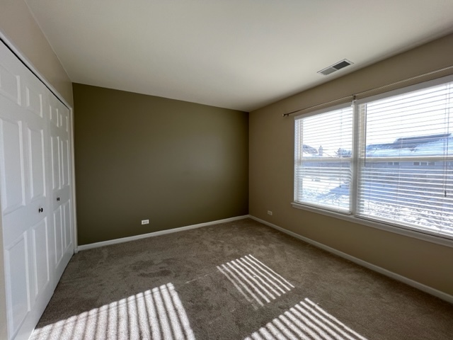 Undisclosed Address Naperville, IL 60564 - Photo 17 of 26 a view of an empty room with a window
