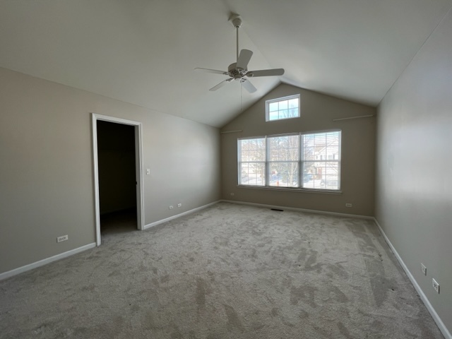 Undisclosed Address Naperville, IL 60564 - Photo 19 of 26 an empty room with windows and chandelier fan