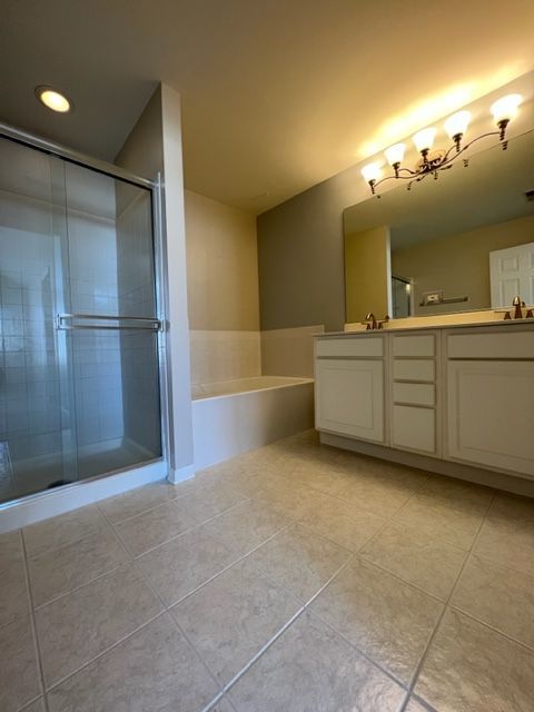 Undisclosed Address Naperville, IL 60564 - Photo 23 of 26 a large bathroom with a large tub shower and sink