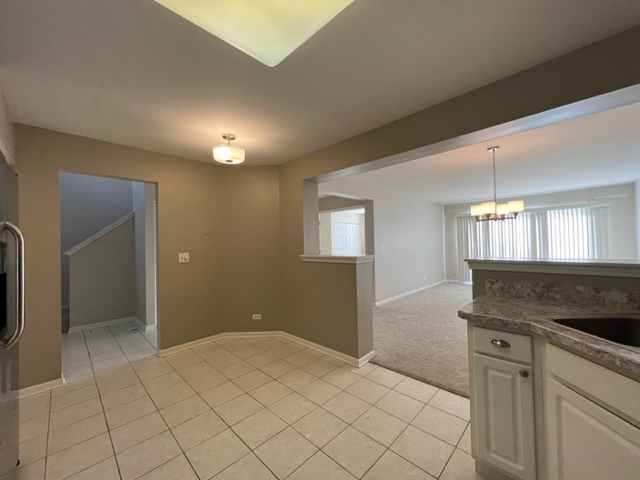 Undisclosed Address Naperville, IL 60564 - Photo 6 of 26 a view of a kitchen cabinets and empty room