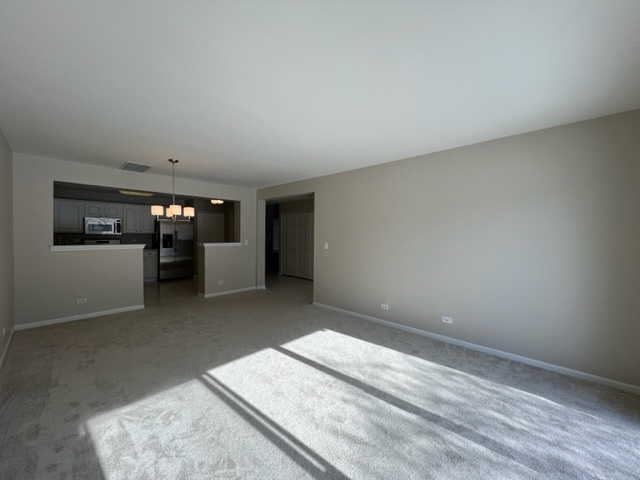 Undisclosed Address Naperville, IL 60564 - Photo 8 of 26 a view of a room with a kitchen